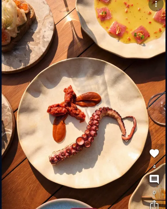 Grilled octopus at a chef's counter
