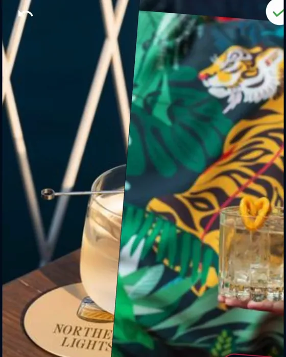 A cocktail against a tiger mural